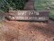 Wooden sign indicating a cart path, restricting automobiles at 405 Baneberry Bnd, Peachtree City, GA 30269