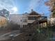 Back of house with deck, screened porch and large yard at 405 Baneberry Bnd, Peachtree City, GA 30269