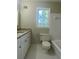 Clean bathroom with granite countertop and bathtub at 5940 Old Bill Cook Rd, Atlanta, GA 30349