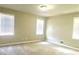 Spacious bedroom with neutral walls and large windows at 5940 Old Bill Cook Rd, Atlanta, GA 30349