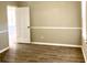 Bright dining room with neutral walls and hardwood floors at 5940 Old Bill Cook Rd, Atlanta, GA 30349