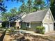 Ranch home with attached two-car garage and mature trees at 5940 Old Bill Cook Rd, Atlanta, GA 30349