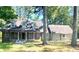 Brick ranch home with attached garage and large yard at 5940 Old Bill Cook Rd, Atlanta, GA 30349