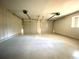 Spacious two-car garage with painted floor and high ceilings at 5940 Old Bill Cook Rd, Atlanta, GA 30349