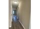 Long hallway with new flooring and neutral walls at 5940 Old Bill Cook Rd, Atlanta, GA 30349
