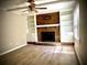 Living room with brick fireplace and built-in shelves at 5940 Old Bill Cook Rd, Atlanta, GA 30349