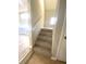 Carpeted staircase leading to the upper level at 5940 Old Bill Cook Rd, Atlanta, GA 30349