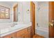 Bathroom with wood vanity and bathtub at 1762 Hunting Creek Se Ln, Conyers, GA 30013