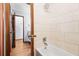 Updated bathroom with a bathtub and tile shower at 1762 Hunting Creek Se Ln, Conyers, GA 30013