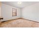 Simple bedroom with carpeted floor and a window at 1762 Hunting Creek Se Ln, Conyers, GA 30013