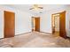 Spacious bedroom with ceiling fan and doors to bathroom at 1762 Hunting Creek Se Ln, Conyers, GA 30013