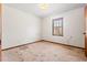 Simple bedroom with carpeted floor and a window at 1762 Hunting Creek Se Ln, Conyers, GA 30013