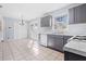 Eat-in kitchen with gray cabinets and tiled floors at 1762 Hunting Creek Se Ln, Conyers, GA 30013