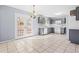 Eat in kitchen with gray cabinets and access to backyard at 1762 Hunting Creek Se Ln, Conyers, GA 30013
