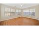 Sunroom with wood-look floors and many windows at 913 Arbor Way, Mcdonough, GA 30253