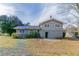Exterior view of gray two-story house with backyard and small patio at 1151 Martin Rd, Stone Mountain, GA 30088