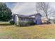 Rear exterior view of a gray two-story house with a grassy lawn at 1151 Martin Rd, Stone Mountain, GA 30088