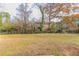 Spacious, fenced backyard with trees and a chain-link fence at 1151 Martin Rd, Stone Mountain, GA 30088