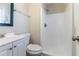 Bathroom with a shower, white tiled walls, and a white vanity at 1151 Martin Rd, Stone Mountain, GA 30088