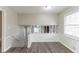 View of the staircase landing with wood-look flooring and a partial view of the living room at 1151 Martin Rd, Stone Mountain, GA 30088