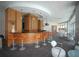 Modern bar area with wood cabinetry, orange bar stools, and stylish lighting at 3338 Ne Peachtree Ne Rd # 1102, Atlanta, GA 30326