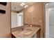 Modern bathroom with granite countertop and large mirror at 3338 Ne Peachtree Ne Rd # 1102, Atlanta, GA 30326