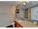 Modern bathroom with granite countertop, wooden cabinets, and a shower at 3338 Ne Peachtree Ne Rd # 1102, Atlanta, GA 30326