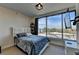 Modern bedroom with large windows offering scenic views, a queen-sized bed, and a wall-mounted TV at 3338 Ne Peachtree Ne Rd # 1102, Atlanta, GA 30326