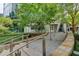 Modern building exterior with lush landscaping and inviting entrance at 3338 Ne Peachtree Ne Rd # 1102, Atlanta, GA 30326