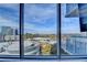 Expansive view of the cityscape with buildings, trees, and parking areas, seen through large windows at 3338 Ne Peachtree Ne Rd # 1102, Atlanta, GA 30326