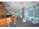 Stylish community room with bar, seating area, and pool views at 3338 Ne Peachtree Ne Rd # 1102, Atlanta, GA 30326