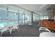 Community room with modern furniture, a bar area, and views of the pool at 3338 Ne Peachtree Ne Rd # 1102, Atlanta, GA 30326