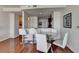 Dining area with glass-top table, white chairs, and hardwood floors at 3338 Ne Peachtree Ne Rd # 1102, Atlanta, GA 30326