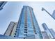 Modern high-rise building with glass exterior and balconies at 3338 Ne Peachtree Ne Rd # 1102, Atlanta, GA 30326