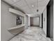 Modern hallway with tile flooring, modern lighting, and large artwork at 3338 Ne Peachtree Ne Rd # 1102, Atlanta, GA 30326