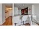 Kitchen with breakfast bar, hardwood floors, and view of entryway at 3338 Ne Peachtree Ne Rd # 1102, Atlanta, GA 30326