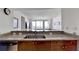 Kitchen with granite countertops, double sink, and wood cabinetry at 3338 Ne Peachtree Ne Rd # 1102, Atlanta, GA 30326