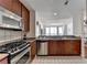 Updated kitchen with granite countertops, wood cabinets, and stainless steel appliances at 3338 Ne Peachtree Ne Rd # 1102, Atlanta, GA 30326