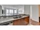 Kitchen with stainless steel appliances, granite countertops, and pass-through to dining area at 3338 Ne Peachtree Ne Rd # 1102, Atlanta, GA 30326