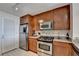 Kitchen with stainless steel appliances, granite countertops, and ample cabinet space at 3338 Ne Peachtree Ne Rd # 1102, Atlanta, GA 30326