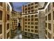 Wine cellar with wooden lockers, brick wall, and a ladder at 3338 Ne Peachtree Ne Rd # 1102, Atlanta, GA 30326