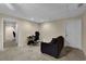 Spacious basement room with a desk, couch, and access to other areas at 102 Twilight Overlook, Canton, GA 30114