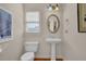 Small bathroom with pedestal sink and window at 102 Twilight Overlook, Canton, GA 30114