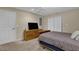 Basement bedroom with dresser, TV, and double doors at 102 Twilight Overlook, Canton, GA 30114