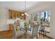 Breakfast nook with glass table, built-in cabinets, and deck access at 102 Twilight Overlook, Canton, GA 30114