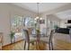 Bright breakfast nook with glass table and deck access at 102 Twilight Overlook, Canton, GA 30114