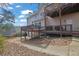 Home's back exterior with two-tiered deck and landscaping at 102 Twilight Overlook, Canton, GA 30114