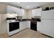 Basement kitchenette with white cabinets and appliances at 102 Twilight Overlook, Canton, GA 30114