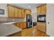 Kitchen features wood cabinets and granite countertops at 102 Twilight Overlook, Canton, GA 30114