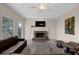 Living room with fireplace, large windows, and comfy seating at 102 Twilight Overlook, Canton, GA 30114